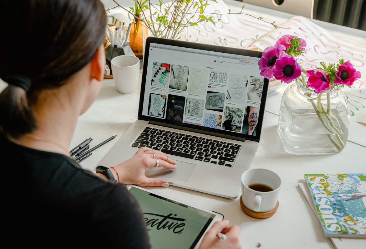 Photo Of Person Using Laptop For Graphic Designs 